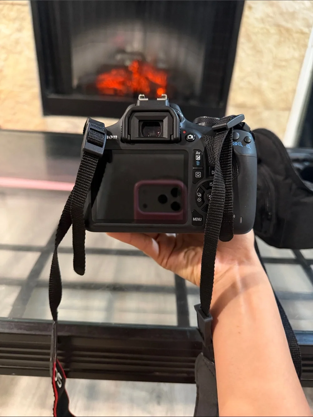 Canon Black DSLR Camera with Black Lens and Red-Trim Strap